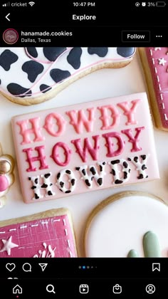 cookies decorated with the words howdy howby howby are displayed on a table