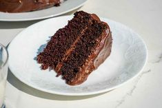 a slice of chocolate cake on a white plate