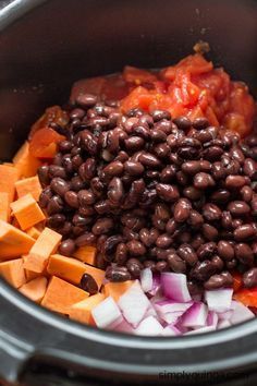 beans, carrots and onions are mixed in the slow cooker to make an entree