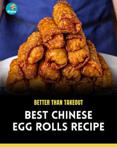 a person holding a plate full of fried egg rolls with the words, better than takeout best chinese egg rolls recipe