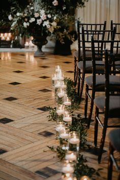 rows of candles are lined up on the floor