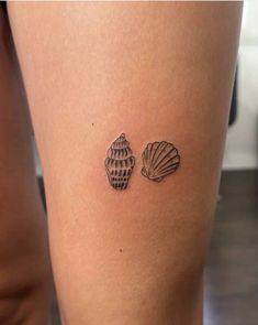 two seashells tattoo on the thigh