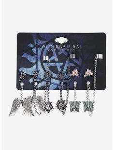 four pairs of charms with chains hanging from the front and one on the back of each charm