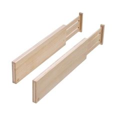 two unfinished wooden pegs on a white background