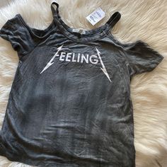 For All The Rocker Girls Out There! Grab This Cold Shoulder Tee With The Cool Feelingz Graphic Dead Center! Nwt, Never Worn Brand: Charlotte Russe Size: Xs Edgy T-shirt For Summer Music Festival, Casual Letter Print Top For Music Festival, Trendy Graphic Print Tops For Music Festival, Trendy Crew Neck Tops For Music Festival, Grunge Tops For Summer Music Festival, Summer Grunge Tops For Music Festival, Casual Short Sleeve Tops For Music Festival, Summer Music Festival Grunge Tops, Rebellious Cotton Top With Graphic Print