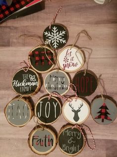 christmas ornaments are arranged on a wooden table