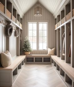 a room filled with lots of wooden shelves next to a window