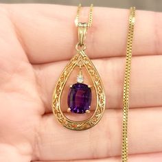 Elegant And Alluring Vintage Style Filigree Teardrop Shape Double Drop Pendant! Featuring A 9x7mm Deep Medium Purple Oval Cushion Cut Amethyst, And A 2mm Round Cut White Topaz Or White Sapphire; Set In 14k Solid Yellow Gold. New 18” 0.8mm Gold Vermeil (14k Plated Over Sterling Silver) Box Chain Included! The Pendant Is Marked Wl 585; And Acid Tested As 14k Solid Yellow Gold. The Pendant Measures 34x17mm The Pendant Weighs 2.98g Vintage Condition: Good (Minor Wear On The Setting/Bail; Very Minor Purple Amulet, Amethyst Gold, Medium Purple, Silver Box, Yellow Gold Pendants, Amethyst Necklace, Fan Book, Drop Pendant, White Sapphire