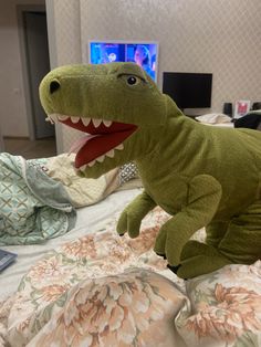 a stuffed t - shirt that looks like a dinosaur with it's mouth open