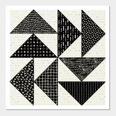 an abstract black and white artwork piece with different shapes on the side, including triangles