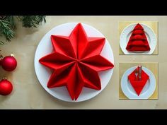 a red origami star on a white plate next to christmas ornaments and decorations