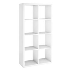 a white bookcase with four shelves on each side