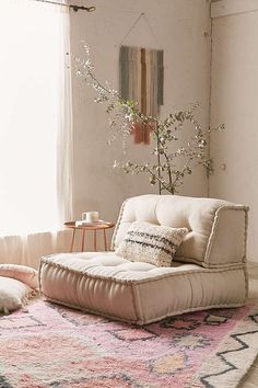 a living room filled with furniture and a rug