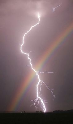 a rainbow appears to be in the sky with lightning