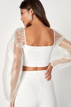 You'll get all the attention when you arrive at the party wearing the Lulus Sheerly Sultry Ivory Organza Balloon Sleeve Two-Piece Jumpsuit! Airy woven organza shapes sheer balloon sleeves (with elastic at the cuffs and shoulders) that frame a cropped bodice (composed of stretchy crepe knit) with flattering bust darts. Matching high-rise bottoms have wide pant legs. Hidden back zipper. Fit: This garment fits true to size. Length: Floor length. Size medium Inseam: 33.00 Front Rise: 12.00 Bust: Gre Elegant Summer Crop Top With Sheer Sleeves, Chic Evening Crop Top With Sheer Sleeves, Feminine Sheer Tops For Party, Elegant Crop Top With Sheer Sleeves For Night Out, Elegant Sheer Tops For Party Season, Elegant Spring Crop Top With Sheer Sleeves, Elegant Crop Top For Summer Party, Elegant Summer Crop Top For Party, Chic Crop Top With Sheer Sleeves For Summer