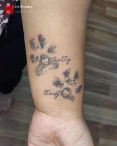 a person with a tattoo on their arm that says stay sweety and paw prints