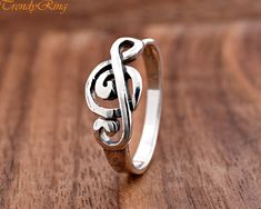 9mm Solid 925 Sterling Silver Treble Clef Musical Symbol Ring ▷Gift Box Included ▷9mm Height ▷Size 4 - 10 Available ▷925 Sterling Silver (not plated or filled) ▷925 Stamp Authenticity https://www.etsy.com/shop/TrendyRing Treble Clef Ring, Nickel-free Music-themed Metal Jewelry, Music Note Ring, Silver Sterling Music-themed Necklace, Ring Gift Box, Nickel-free Sterling Silver Music-themed Necklace, Treble Clef, Music Note, Silver Jewelry Rings