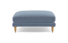 a blue footstool with wooden legs on an isolated white background, the foot rest is upholstered