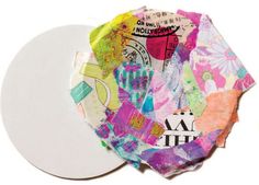 a paper plate covered in different colored papers