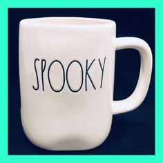 a white coffee mug with the word spooky written on it