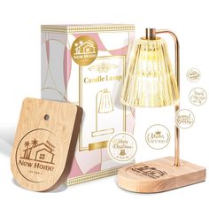 the new home candle lamp is next to its wooden box and light bulb in front of it