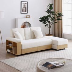 a living room with a white couch and coffee table