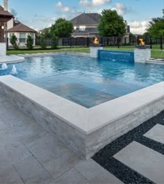 an empty swimming pool in the middle of a yard