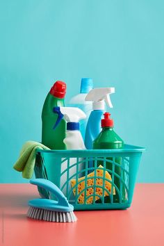 cleaning supplies in a basket on a table