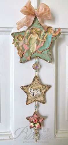 the door is decorated with an angel and star ornament hanging from it's side