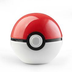 a red and white pokemon ball sitting on top of a table