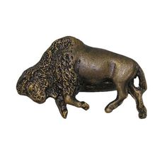 a bronze statue of a bison on a white background