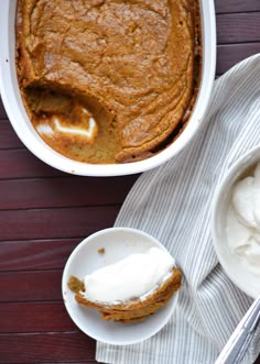 a bowl of whipped cream next to a dish of carrot cake