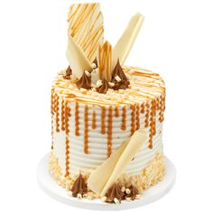 a white cake with caramel drizzled on top