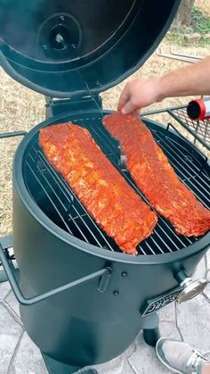 someone is grilling some meat on the grill