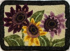 a close up of a rug with flowers on it