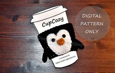 a crocheted penguin with a coffee cup on its head