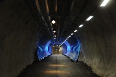 a long tunnel with blue lights in it