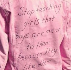 a pink jacket with writing on it that says stop teaching girls that boys are mean to them because they like them