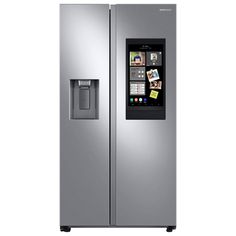 a silver refrigerator freezer sitting next to a white wall with pictures on the door