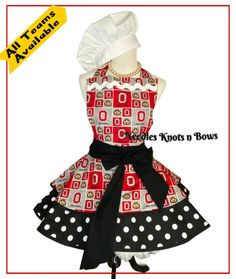 an apron with polka dots on it and a chef's hat in the center