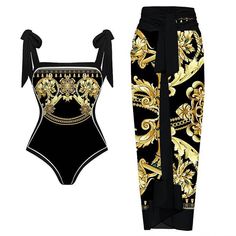 a black and gold one piece swimsuit with an attached tie around the waist, along with matching pants