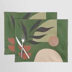 two placemats with forks and spoons on top of each other in front of a green background