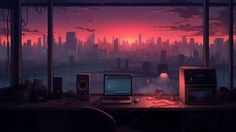 a computer desk in front of a window with a view of the city at sunset