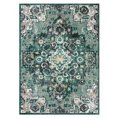 a green rug with an ornate design on it