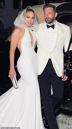 a man in a tuxedo standing next to a woman in a wedding dress