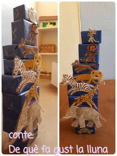 a blue cake with giraffes and zebras on it