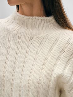 A hero piece in our latest collection, this standneck is crafted of a luxurious cashmere blend that sustains volume and loft, with a super soft hand-feel. The wide ribbing adds texture and depth, making this sweater feel extra special. An easy fit and relaxed drop shoulders deliver both style and comfort. Perfect for layering or wearing on its own, this sweater will make a standout addition in your cold-weather wardrobe. Details Oversized fit. Long sleeve. Length in size small is 20". The model White Cashmere Sweater, Cashmere Travel Wrap, Boutique Sales, Wrap Cardigan, Cardigan Top, Knitwear Cardigan, Sweater Sale, Soft Hands, Soft Hand