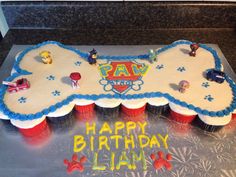 a birthday cake with paw patrol frosting on it