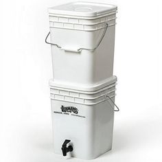 two white coolers stacked on top of each other