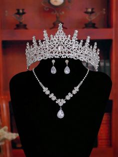 a tiara and necklace on display in a store